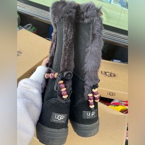 Likely use , black ugg boot